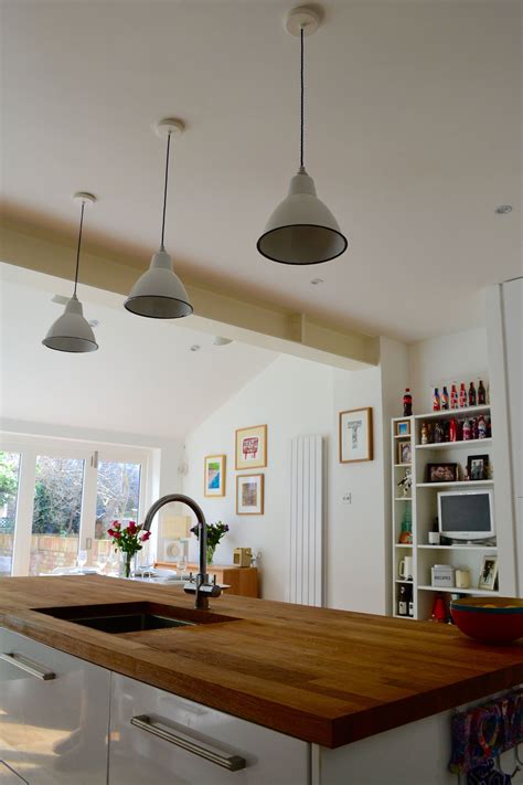 Shop for kitchen worktops today! Benchmarx white gloss kitchen with oak worktops and grey ...