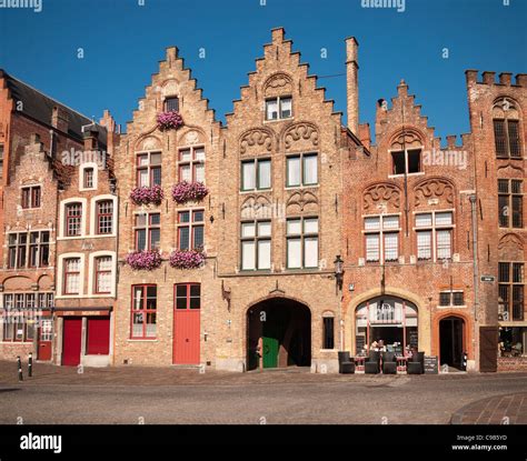 Historic Buildings At Jan Van Eyckplein Bruges Belgium Stock Photo