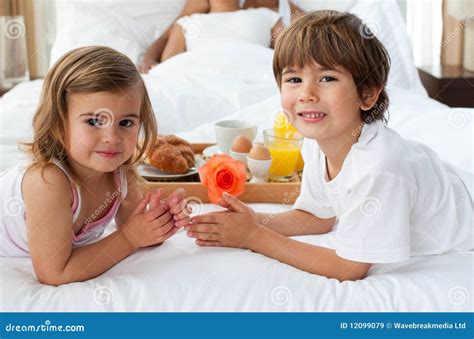 brother and sister having breakfast with their stock image image of breakfasting relaxing