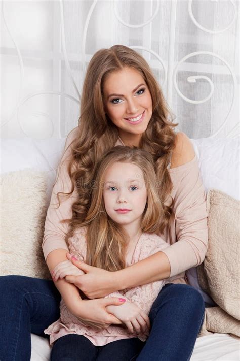Pretty Mother Cuddling With Daughter Stock Image Image Of Attractive Happiness 65240737
