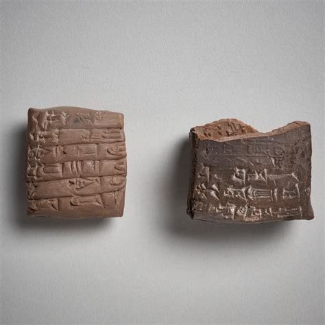 a sumerian clay cuneiform tablet and fragmentary envelope