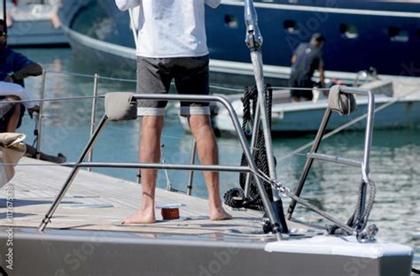 Worker Barefoot On Boat Stock Photo Adobe Stock