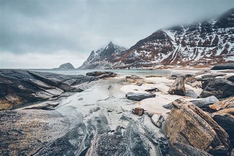 Rocky Coast Of Fjord Of Norwegian Sea In Winter With Snow Haukland