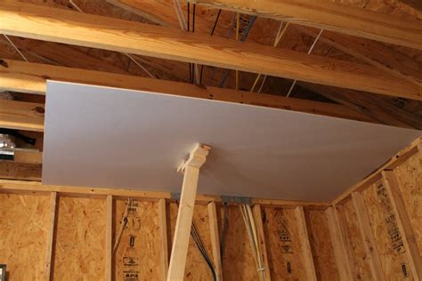 The drywall sheets are usually very heavy and need adequate manpower during installation to ensure they are attached properly to the ceiling beams. Bonus Room Reno - Week 1 - My Sweetnest