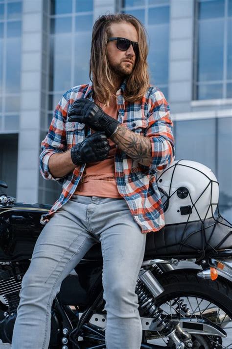 Long Haired Man Biker Driving Custom Motorcycle In City Stock Photo
