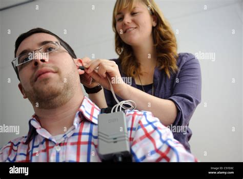 Close Up Of Audiology And Deafness Male Student Having Hearing Aid