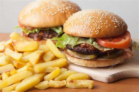 Fastfood Burgers And Fries — Stock Photo © Arthouse 106435236