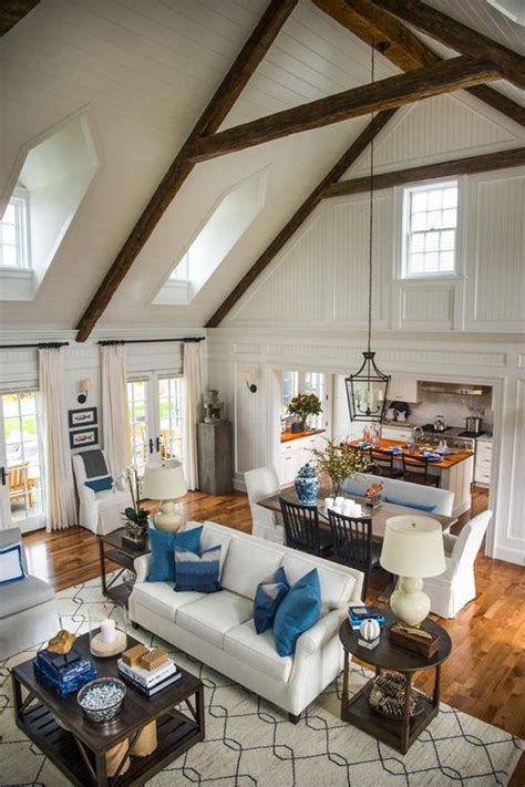 Each yankee barn home is a custom design and has a unique appearance tailored to suit the owner. Gorgeous volume ceilings and beams in this great room! # ...