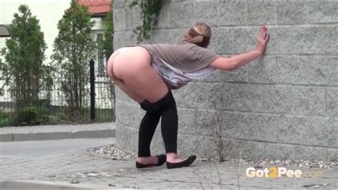 Big Ass Bent Over Girl Takes A Pee On The Street Pissing