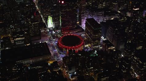 Orbiting Madison Square Garden At Night In Midtown Aerial Stock Footage