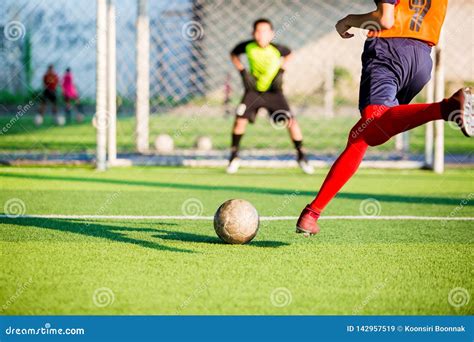 Soccer Player Run To Shoot Ball At Penalty Kick To Goal With Blurry