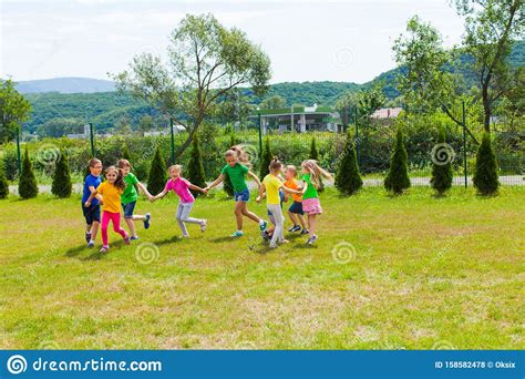 Large Group Of Kids Play Outdoor Games Stock Photo Image