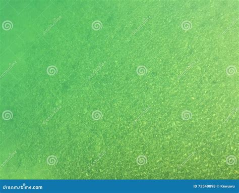Blue Green Shade Of Fresh Lake Water Above Small Stone Pebble Un Stock