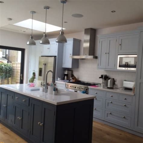 Contemporary Light Grey Kitchen With Large Island And Chrome Finishes