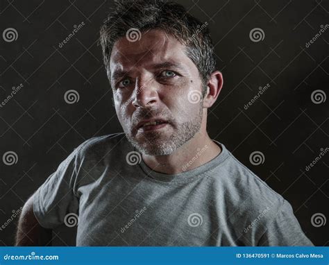 Isolated Dark Background Portrait Of Young Upset And Defiant Man In Arrogant And Cocky Pose