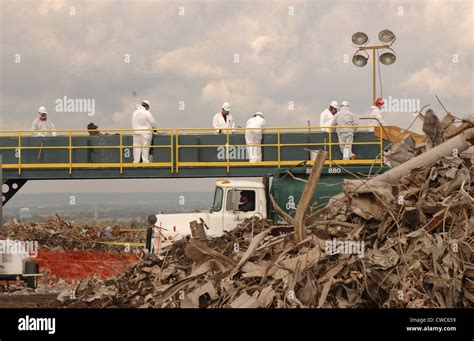 Workers At The Fresh Kills Landfill Examine Debris From The World Trade