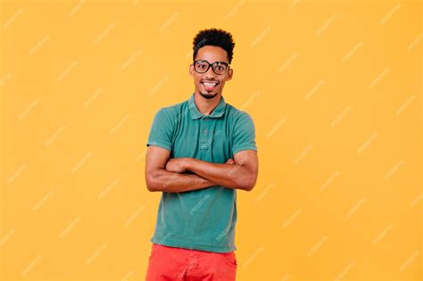 Free Photo Blissful Male Model In Glasses Standing Interested Short