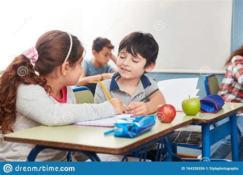 Two Kids Help Each Other While Learning Stock Photo Image Of Help