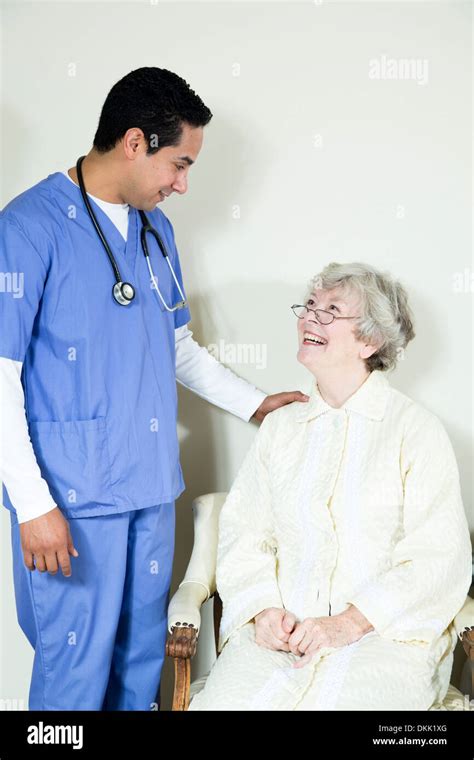 Male Nurse Assisting Elderly Patient Stock Photo Alamy