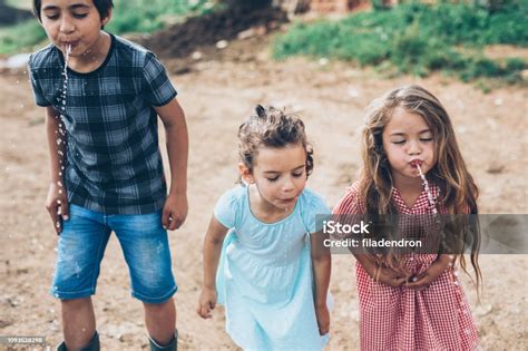 Children Spitting Water Stock Photo Download Image Now Spitting