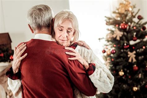 Calm Satisfied Woman Hugging Her Husband Closing Her Eyes Stock Image
