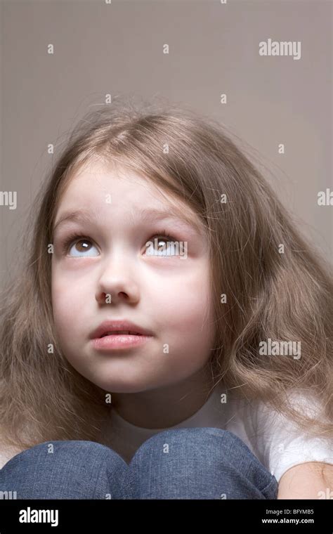 Headshot Of Young Girl Looking Up Stock Photo Alamy