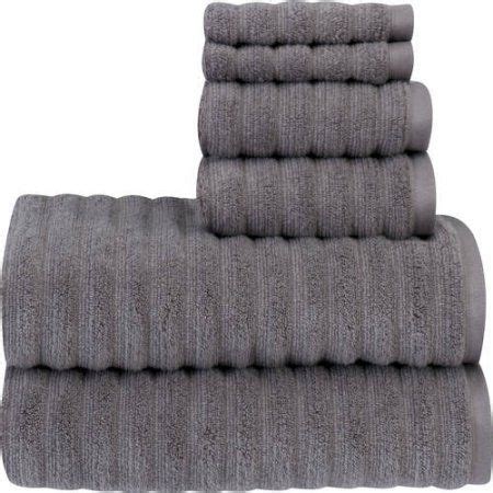 Four Grey Towels Stacked On Top Of Each Other