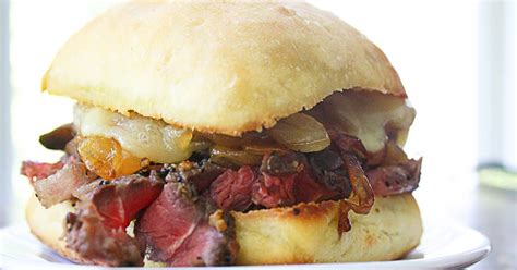 This loaded philly cheesesteak recipe, from throwdown with bobby flay on food network, is topped with a melted provolone sauce, onions, peppers and mushrooms. 10 Best Leftover Steak Sandwich Recipes | Yummly