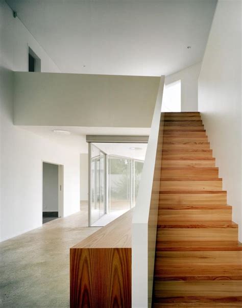 Fancy Minimalist Staircase Design With Natural Hardwood Steps And Solid