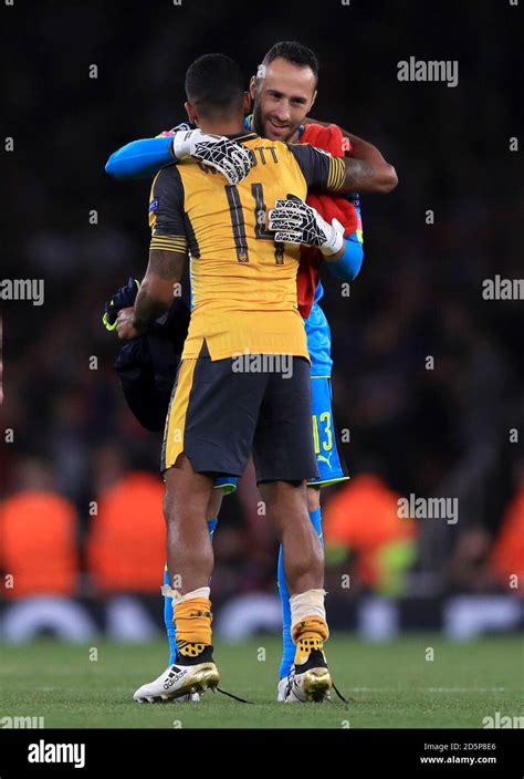 Arsenal Goalkeeper David Ospina And Theo Walcott Embrace After The Game