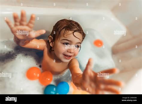 Cheerful Boy Taking Bath Little Child With Pleasure Bathing With Foam