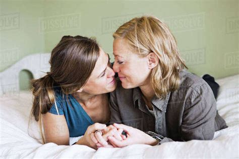 Female Partners Cuddle Stock Photo Dissolve