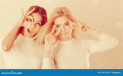 Two Crazy Girls Telling Jokes To Each Other While Having A Rest Stock Image