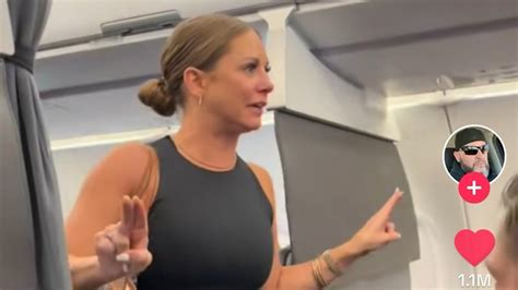 watch hysterical woman threatens to get off plane after seeing passenger who she claims is ‘not