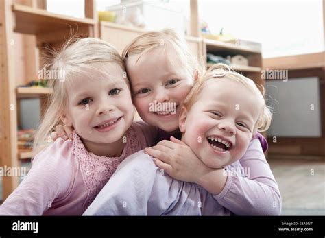 Three Little Girls Best Friends In Kindergarten Stock Photo Alamy