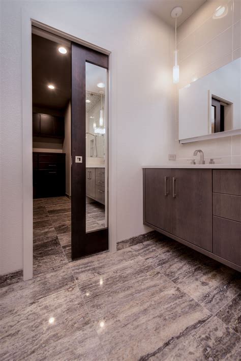 Bathroom Remodel With Mirrored Pocket Door By Highcraft Builders