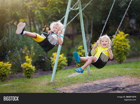 Child Swinging On Image And Photo Free Trial Bigstock