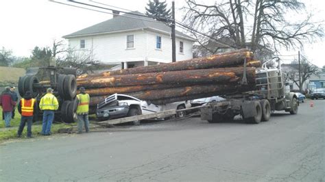 Log Truck Spills Load Local