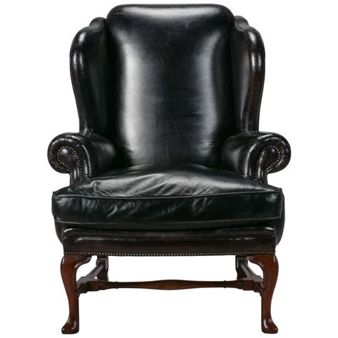 Leather is a traditional option for wing back chairs due to its durability. Large English Black Leather Wing Chair For Sale at 1stdibs