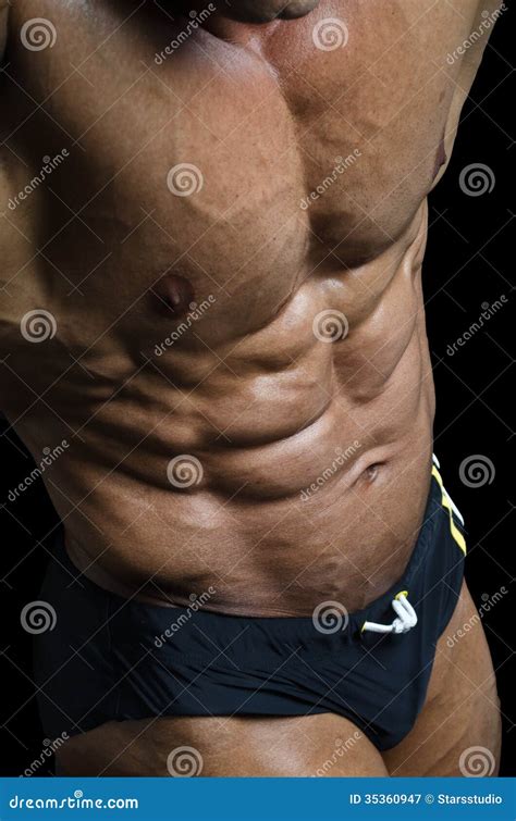 Detail Of Bodybuilder Torso Ripped Abs And Pecs Royalty Free Stock