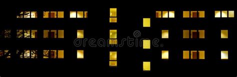 Front Of A Building With Lit Up Windows At Night Stock Image Image Of