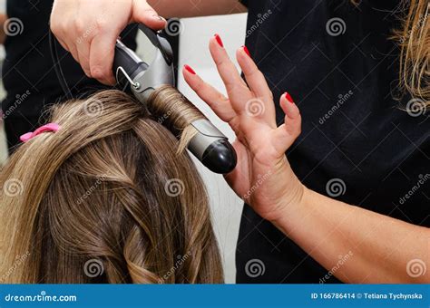 Stylist Making A Hairdo With Hair Curler Beauty Salon Editorial Stock