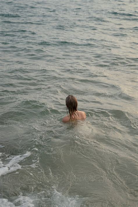 Woman Swimming Naked In The Sea By Stocksy Contributor Olga Kozicka