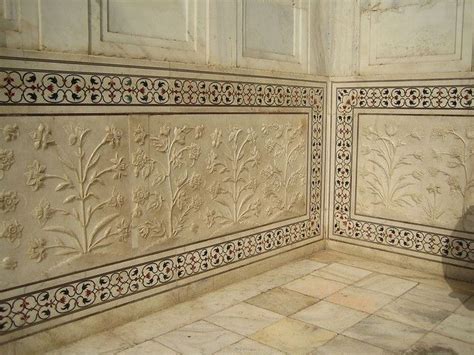 A Close Up Of The Detail In The Inlaid Precious Stone And Carved Marble