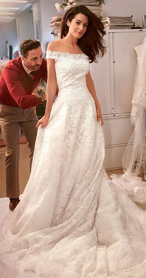 Inside Amal Alamuddins Wedding Dress Fitting With Oscar De La Renta And Vogue 2174843 Weddbook
