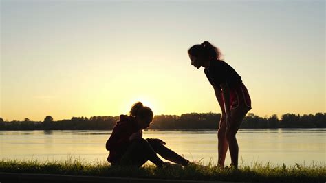 Silhouette Of Girl Giving Helping Hand To Stock Footage Sbv 338792472