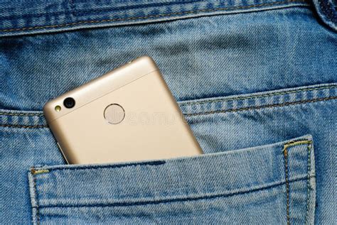 Modern Smartphone In The Old Jeans Pocket Stock Photo Image Of Denim