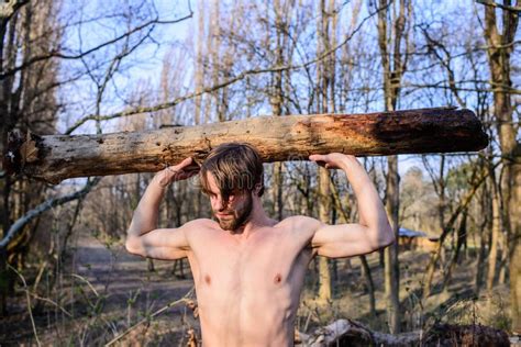 Man Brutal Strong Attractive Guy Collecting Wood In Forest Lumberjack
