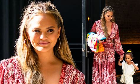 Chrissy Teigen Is A Boho Babe In Red Cut Out Dress As She Braves New