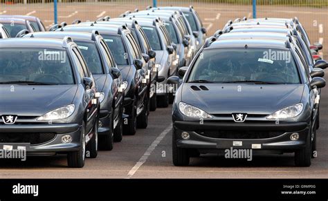 New Cars Await Transportation At The Peugeots Ryton Plant Near